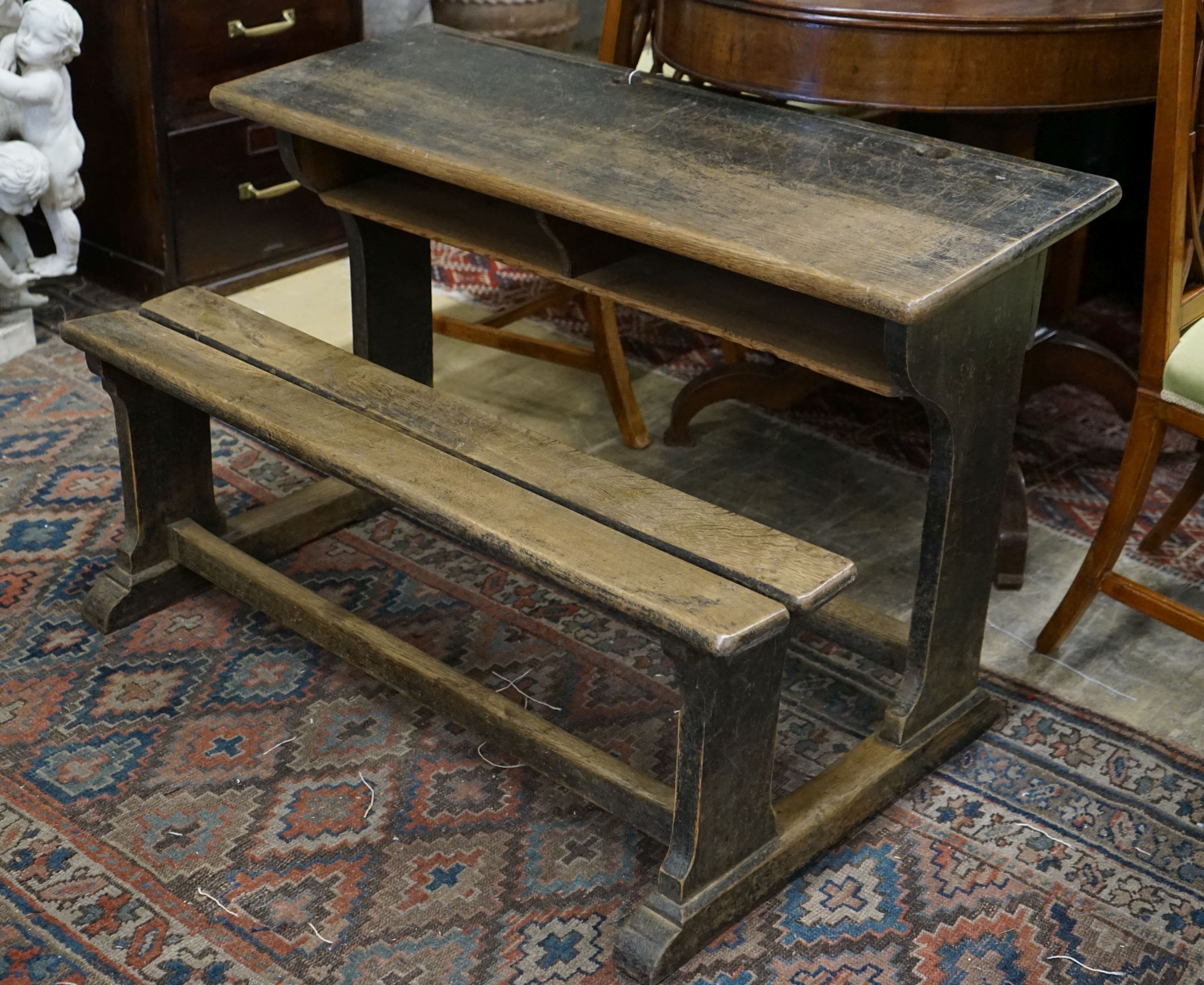 A vintage oak double student's desk, width 105cm, depth 65cm, height 67cm